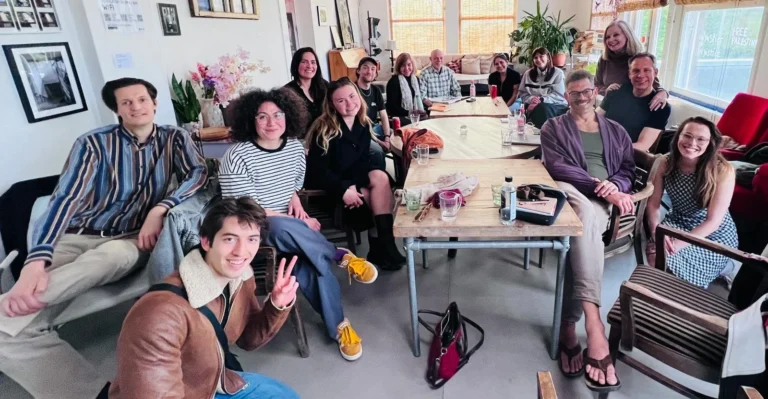 Actors sitting at the first round table at Open House Studios